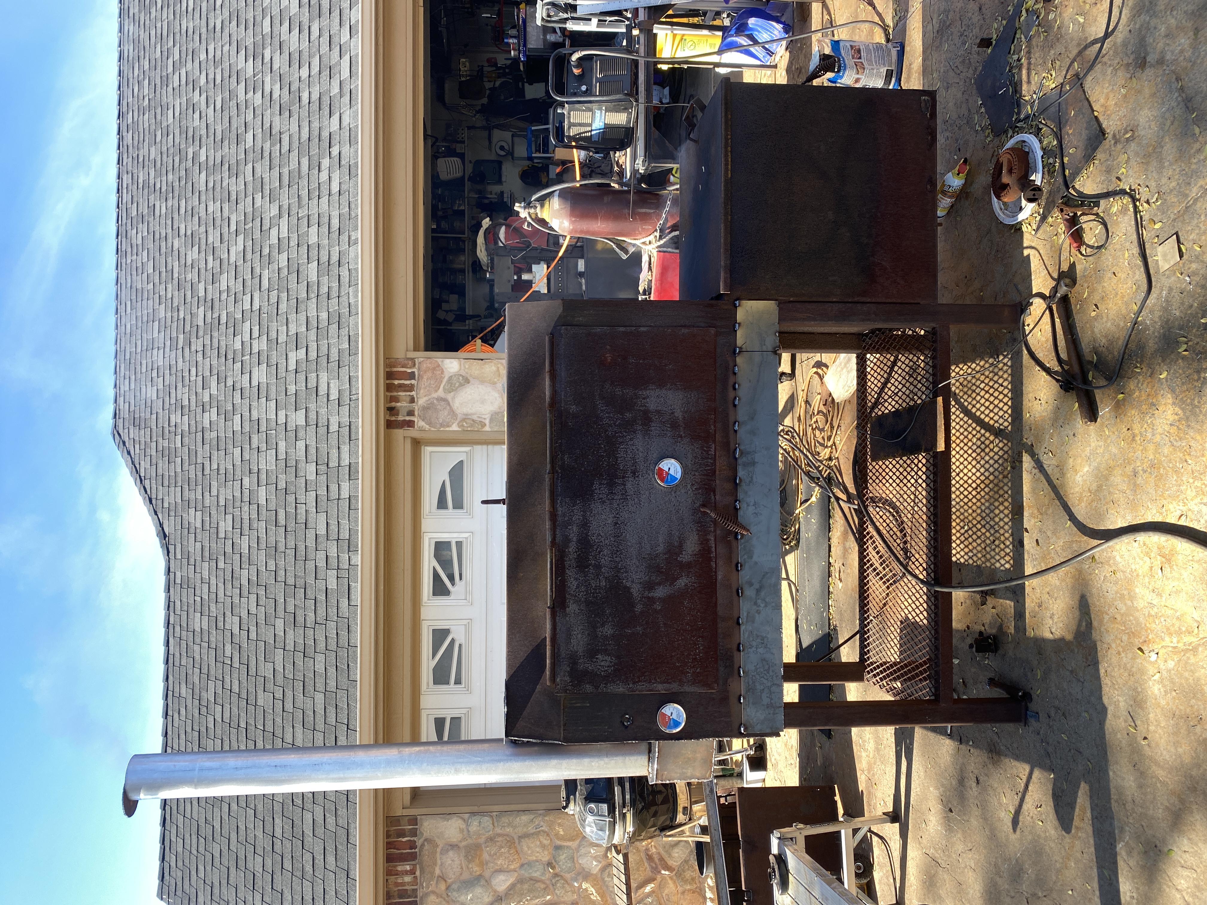 Modified smoker with raised stack and accumulator
